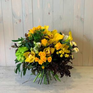 Flower bouquet of yellow roses and orchids