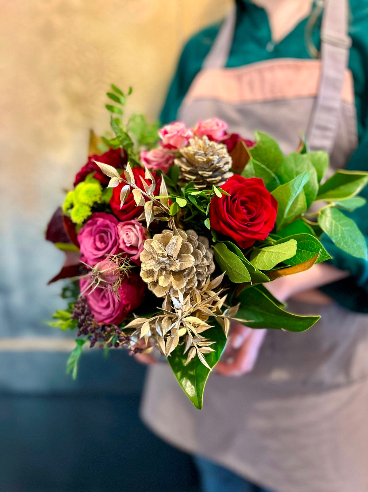 Yuletide Flower Arrangement in Pinks and Reds