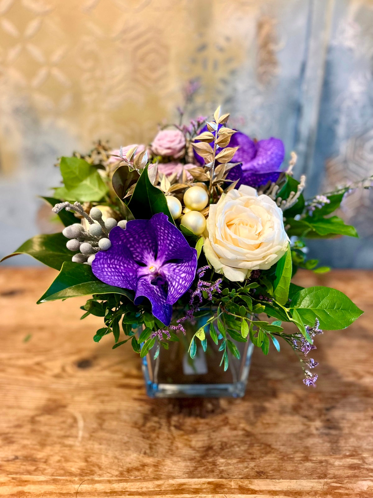 Yuletide Flower Arrangement in Purple and White.