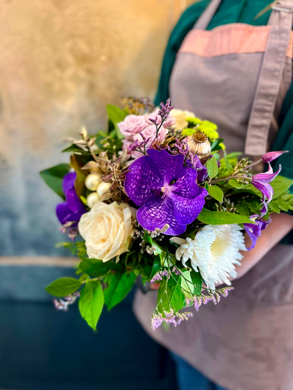 Yuletide Flower Arrangement in Purple and White.