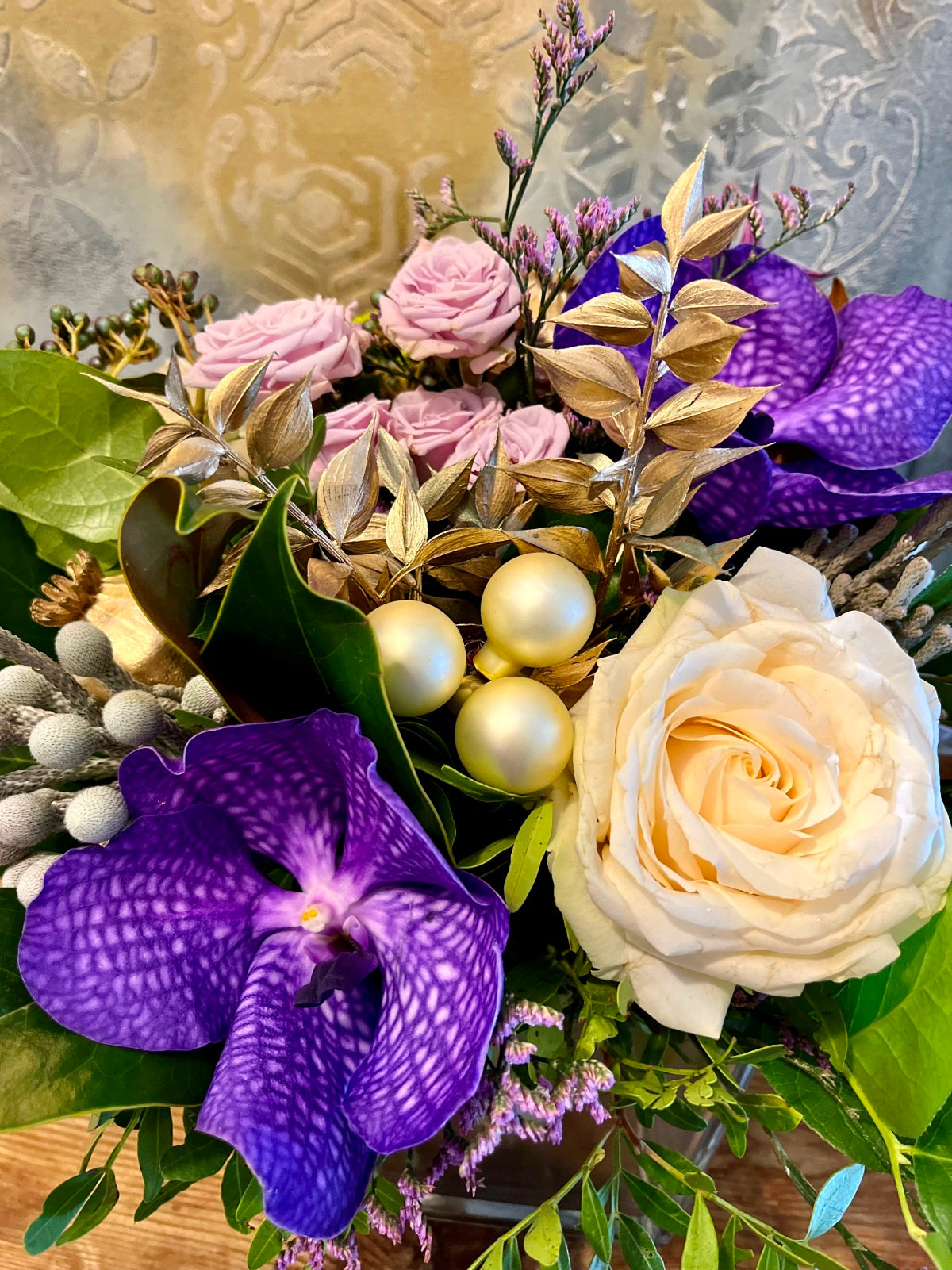 Yuletide Flower Arrangement in Purple and White.