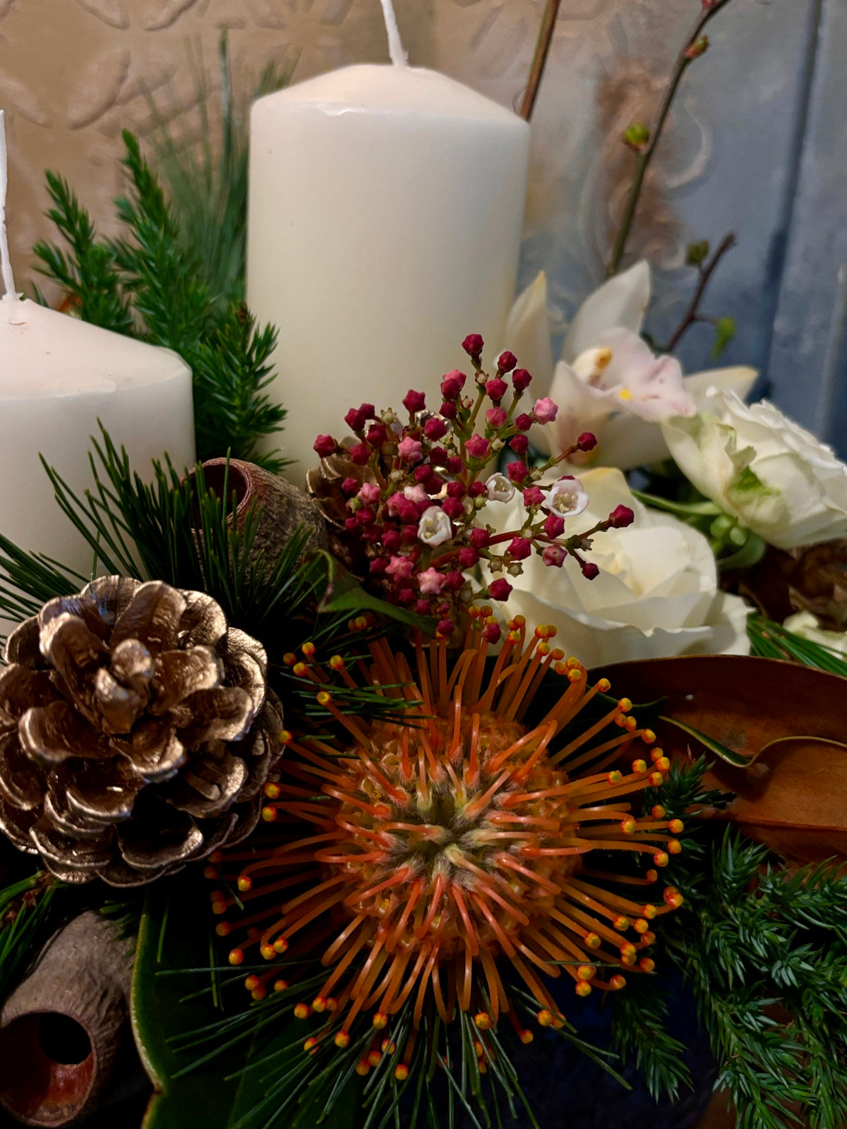 Large Christmas Candle and White Flower Arrangement in Urn