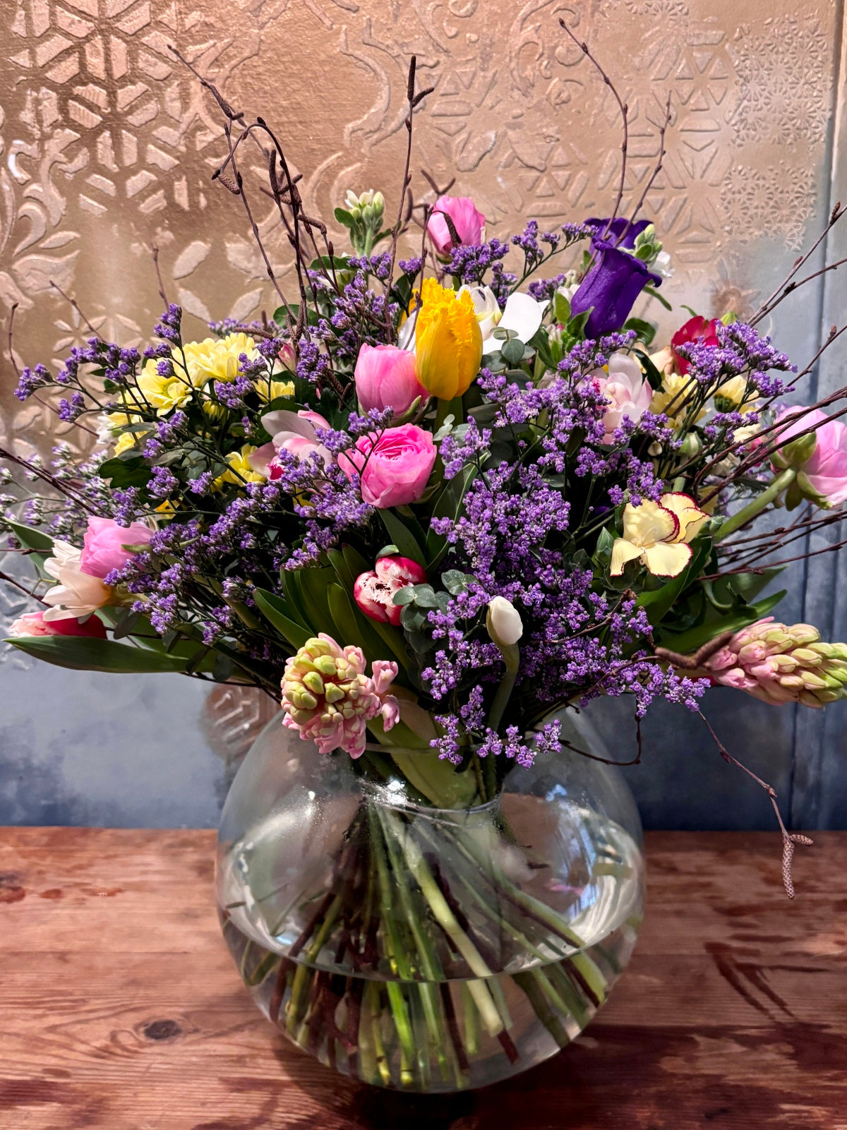 Extravagant Spring Flowers in Goldfish Bowl Vase