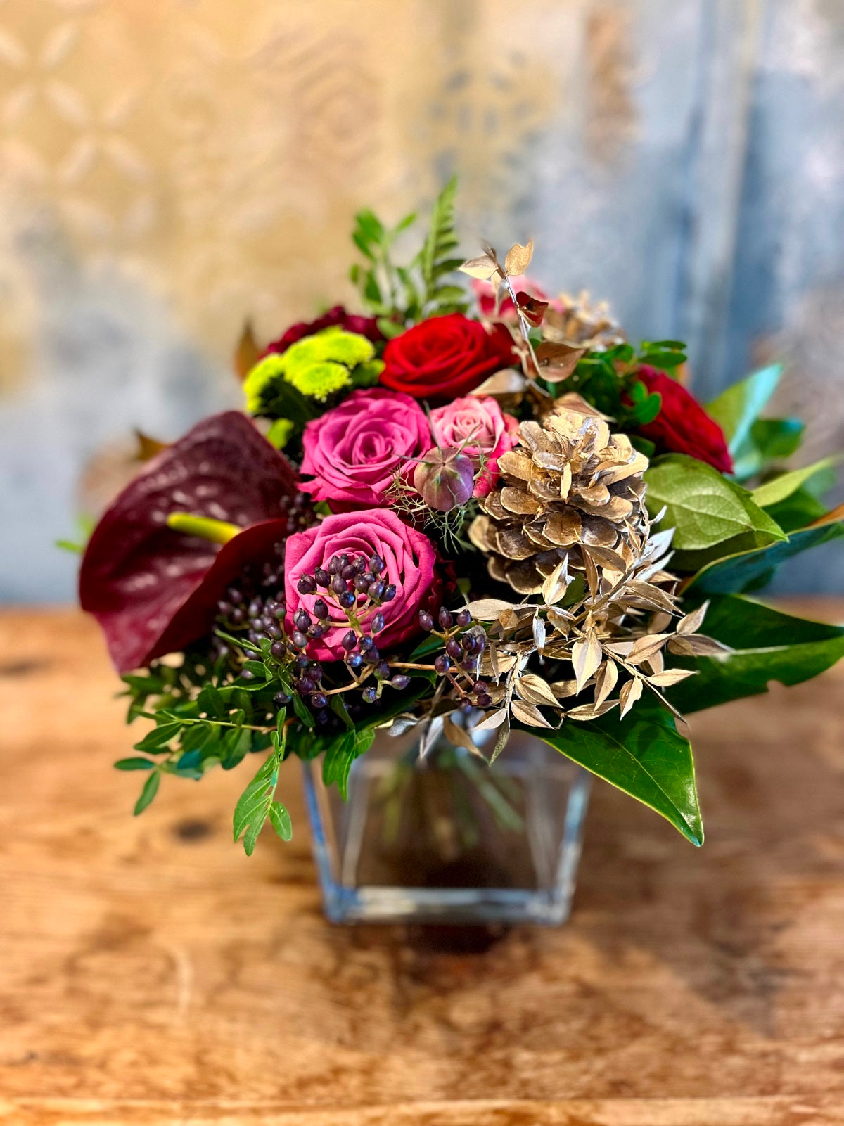 Yuletide Flower Arrangement in Pinks and Reds